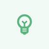 A green light bulb icon on a white background, symbolizing innovation and creativity.